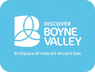 Logo for "Discover Boyne Valley" with stylised white overlapping lines on a blue background. Text reads: "Discover Boyne Valley. Birthplace of Ireland's Ancient East." Perfect for Navan Adventure Centre explorers.